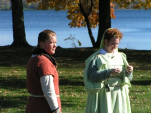 women standing near a lake