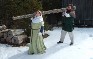 Nero and Aneleda lift a big log.