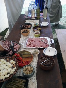 White cheddar and crackers, roast garlic cloves, variety of pickled vegetables, cold ham with mustard, M&Ms, olive assortment, dates stuffed with almonds and baked in honey