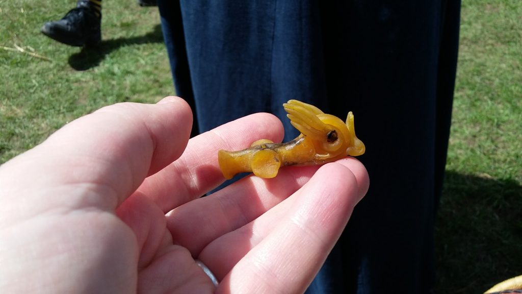 Winged snail sculpted in beeswax